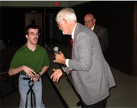 Daniel receives congratulations from Richard Stephens, Director of the Malawi Project.